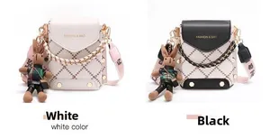 Detail of mini quilted crossbody bags in black and white with cute bunny charms