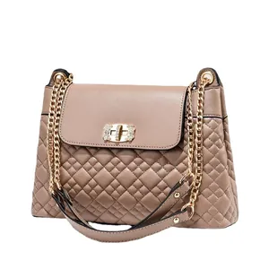 Elegant apricot quilted chain crossbody bag with rhinestone buckle on white background