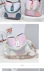 Detail of gradient bucket bag with floral texture and jacquard woven shoulder strap