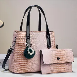 Pink crocodile pattern handbag set with two pieces and a decorative plush pearl charm