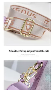 Close-up of golden adjustment buckle and metal hook on gradient woven canvas shoulder strap