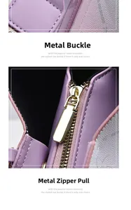 Detail of premium golden hardware buckle and smooth zipper pull on purple leather handbag