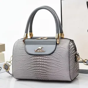 Grey crocodile embossed leather bucket bag with golden kangaroo logo and top handle