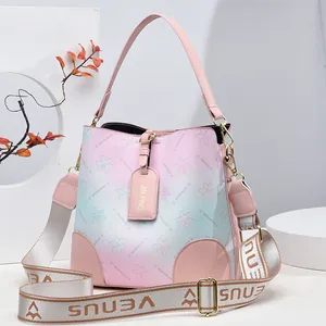 Gradient rainbow bucket bag with star pattern and wide woven strap for women