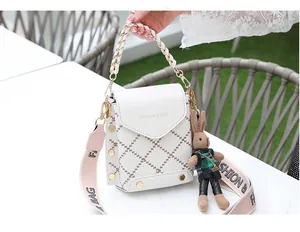 White mini chain crossbody bag detail with fashion lettering and cute bunny pendant