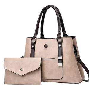 Women's vintage 2-piece tote bag set with matching envelope clutch in beige and brown