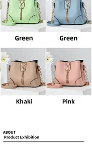 Four colors of fashionable leather bucket bags with cat charms and tassel details