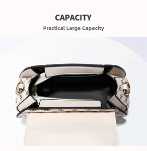 Internal view of the printed handbag showing a spacious main pocket and side slot