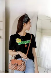 Detail of printed crossbody bag with diamond pattern and retro buckle for women