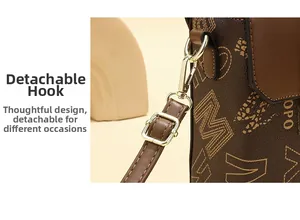 Detail of the brown pebble leather mini bag showing detachable strap and metal hook