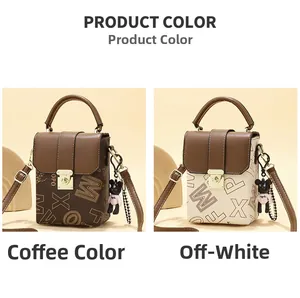 Detailed view of mini crossbody bags in coffee and creamy white with bear charm