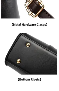 Close-up of gold metal buckles and protective bottom rivets on black leather handbag