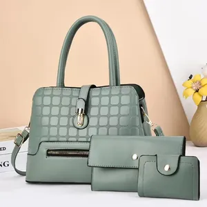Sage green three-piece women handbag set with textured pattern and gold twist lock