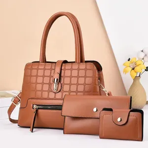 Three-piece women brown handbag set with textured tote, clutch, and wallet in warm tones