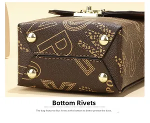 Close-up of brown leather bag base featuring vintage lettering and four metal studs