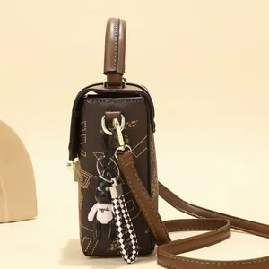Brown monogram small square bag with cute bear charm and adjustable shoulder strap
