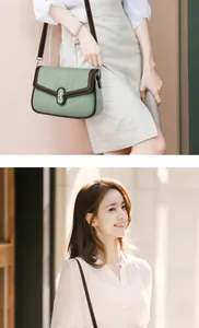 Detail of sage green saddle bag with faux crocodile texture and silver twist lock closure