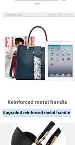 Detail of the 29cm navy tote bag showing the metal reinforced handle and snake pattern