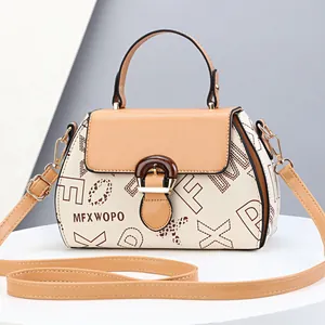 Elegant beige and khaki leather handbag with adjustable strap and designer patterns
