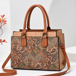 Bohemian cork textured handbag with paisley print and adjustable brown shoulder strap