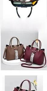 Detailed interior of large capacity leather handbag showing compartments and zipper
