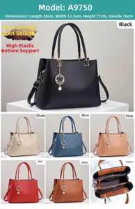 Detail view of large faux leather handbag with dimensions 28x12.5x21cm and metal charm
