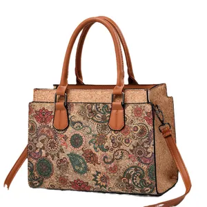 Elegant cork tote bag with paisley mandala patterns and brown leather handles