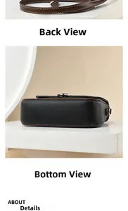 Detailed back view of a black pebbled leather crossbody bag with brown trim and strap