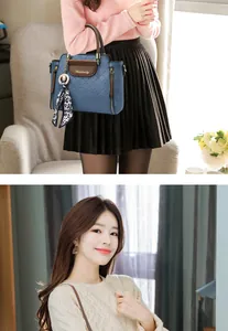 Detail der blauen Stepptasche mit braunen Griffen und elegantem Leoparden-Seidenschal-Dekor