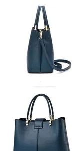 Detail of dark blue lychee grain leather handbag with gold metal hardware and side view