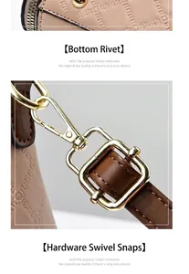 Detailansicht der rosa Ledertasche mit goldenen Bodennieten und Hardware-Schnallen