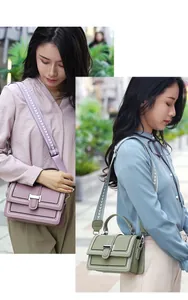 Detail of trendy crossbody bags featuring contrast stitching and wide patterned straps