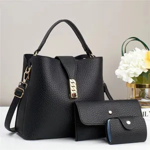 Detailed set of black pebble leather tote bag, clutch and card holder with gold hardware