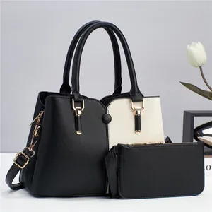 Two-piece color block tote and clutch set with premium pebble leather and gold hardware