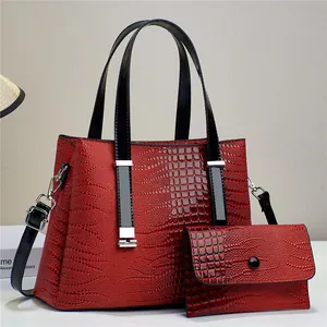 Glossy red crocodile embossed tote bag set with detachable black strap and small pouch