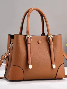 Brown litchi texture tote bag with dual handles and adjustable golden hardware strap