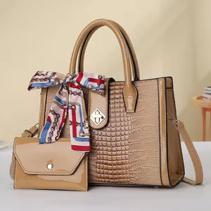 Chic beige crocodile pattern handbag set with decorative silk scarf and matching pouch