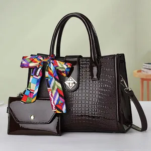 Deep burgundy croc-embossed tote bag set with decorative silk scarf and metal lock detail