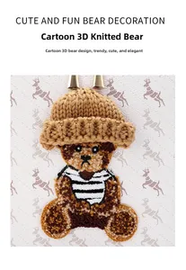 Close-up of 3D knitted teddy bear charm on PVC vintage box bag with deer pattern