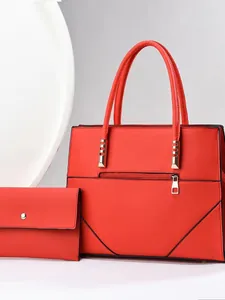 Two-piece red tote bag set with matching wallet and stylish gold metal hardware
