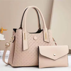 Two-piece set of woven texture handbag and envelope clutch in elegant beige with metal charm