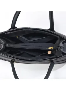 Black leather handbag interior with multi-compartments and gold hardware details