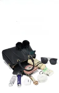 Close-up of black pebble leather tote bag showing large capacity for daily essentials