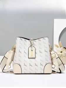 Detail of a beige bucket bag with deer print and premium textured synthetic leather