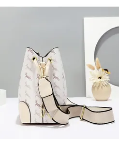 Detail of cream bucket bag with vintage deer print and adjustable wide textile strap