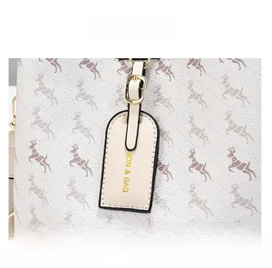 Detailed macro view of the white bucket bag with pebble leather and golden hardware