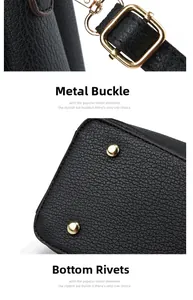 Detail of golden hardware hook and bottom protective rivets on black leather handbag