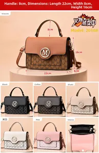 Close-up of letter print texture and golden M logo hardware on women crossbody bag