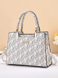Sac à main structuré blanc avec imprimés JOYS noirs et détails dorés chic