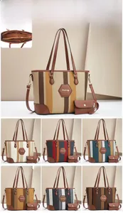 Detailed size specifications for striped tote bag with dimensions and small purse view